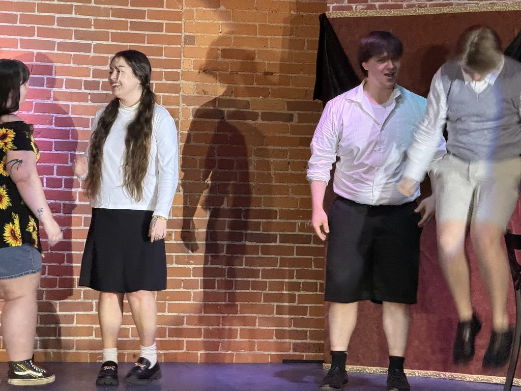 Cast spread across stage levels